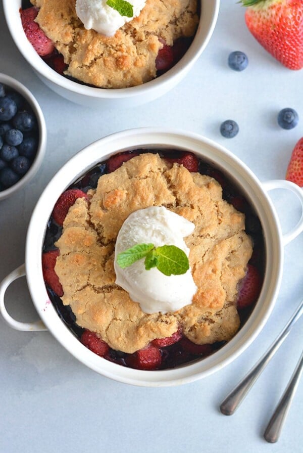 Paleo Berry Cobbler! An irresistible dessert with a delicious almond flour topping! Dairy free, Vegan friendly, easy to make and customize too!