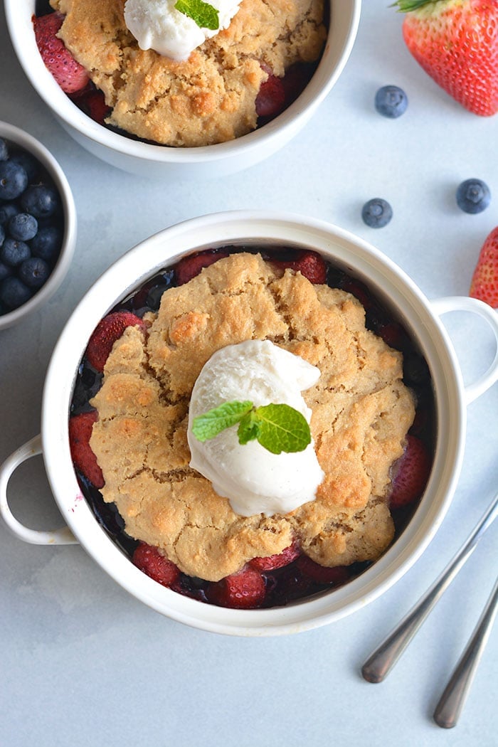 Paleo Berry Cobbler! An irresistible dessert with a delicious almond flour topping! Dairy free, Vegan friendly, easy to make and customize too! 