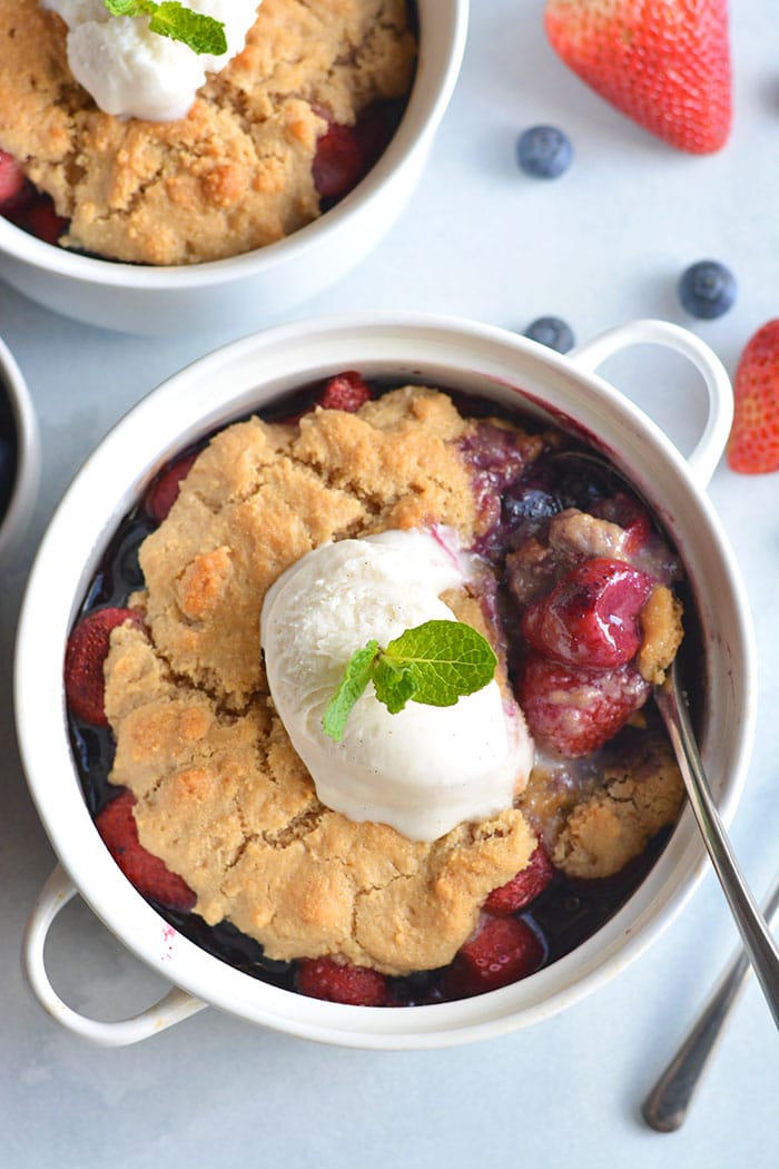 Paleo Berry Cobbler! An irresistible dessert with a delicious almond flour topping! Dairy free, Vegan friendly, easy to make and customize too! 