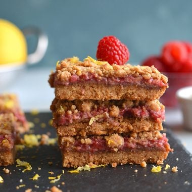 Paleo Vegan Raspberry Crumb Bars! Dairy-free, made with almond flour and wholesome ingredients! A truly addicting grain-free dessert that's good for you. Gluten Free + Low Calorie + Vegan + Paleo