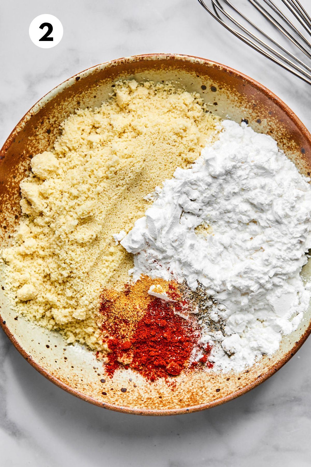 Tapioca, almond flour, and spices added to a plate.
