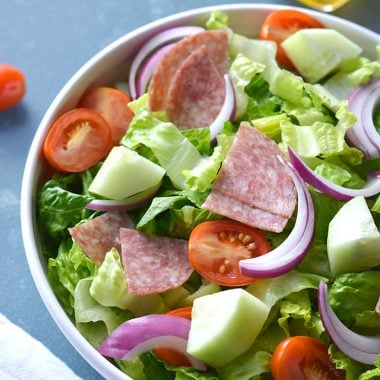 This Low Carb Italian Chopped Salad features crisp summer veggies, salami and a lighter, homemade Italian Dressing. A healthier side salad or summer meal that's mouthwateringly good! Low Carb + Paleo + Gluten Free + Low Calorie
