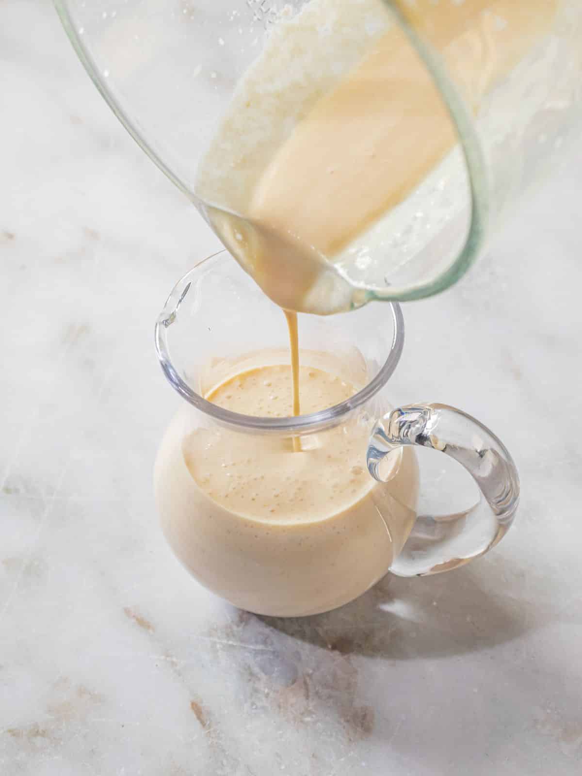 The completed dressing poured into a jar to serve.