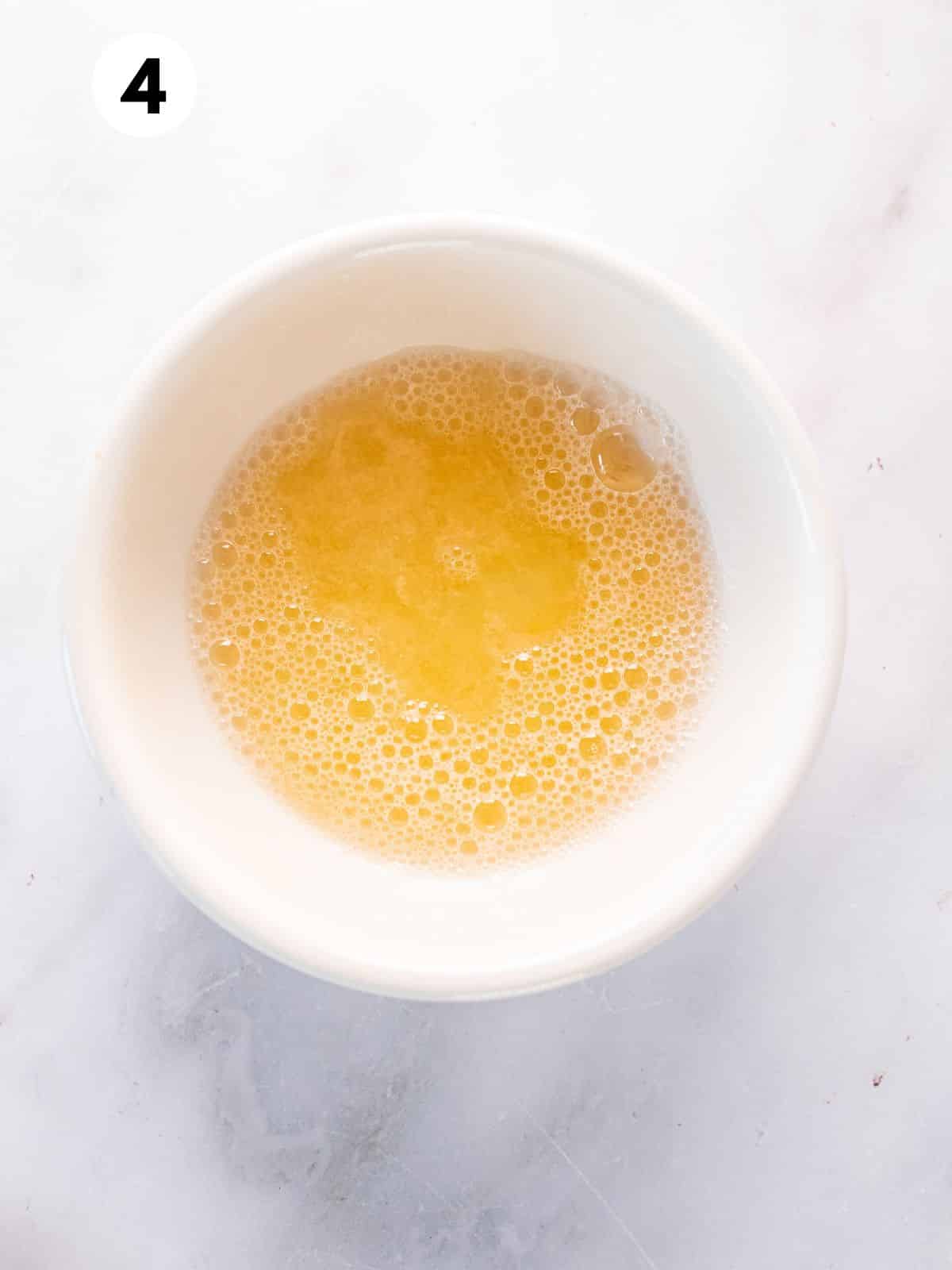 Whisked egg whites in a bowl.