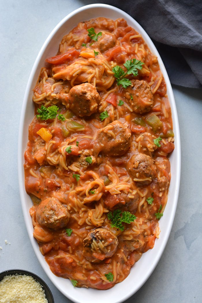 Instant Pot Spaghetti and Meatballs! A delicious one pot meal with chicken meatballs and a homemade tomato sauce. A lighter and healthier meal made in a pressure cooker with gluten free chickpea spaghetti. Gluten Free + Low Calorie