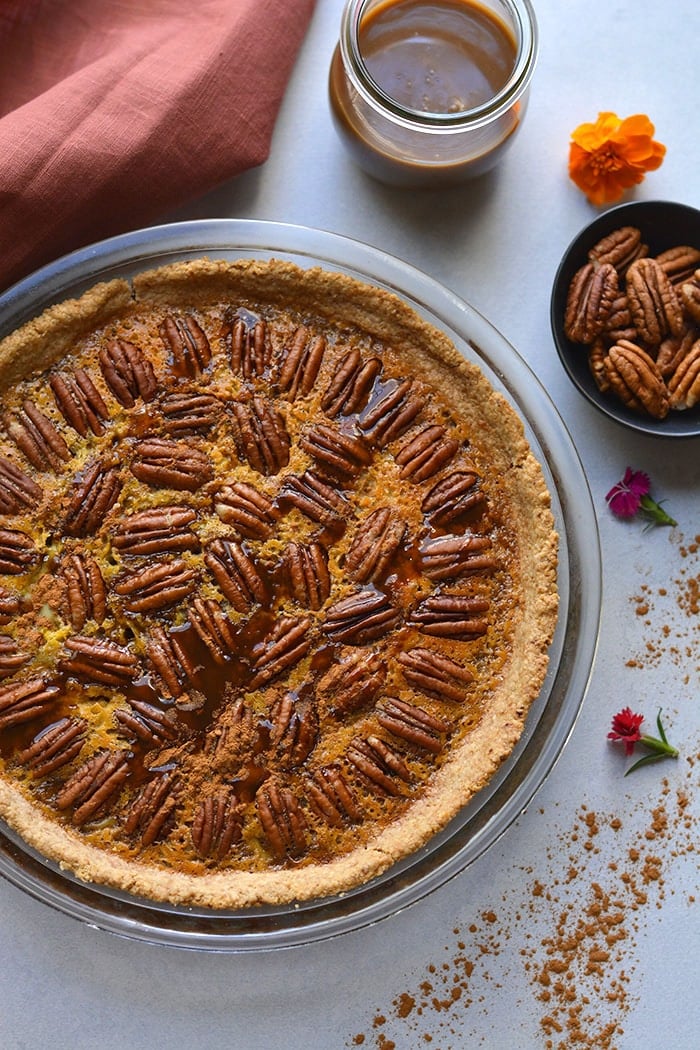 Healthy Caramel Pecan Pie! The best pecan pie made lower in sugar, lightener with less fat topped over a super simple 3 ingredient gluten free crust. The only pie you will ever want to make! Gluten Free + Low Calorie