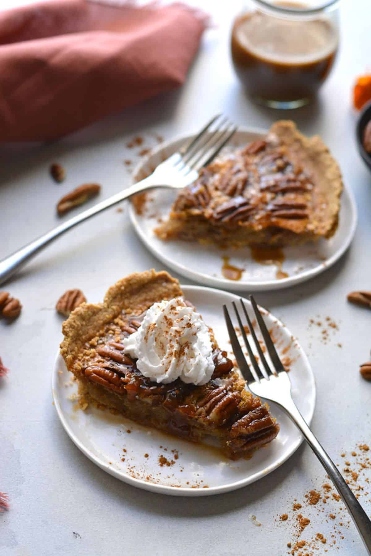 Slices of healthy pecan pie on plates.