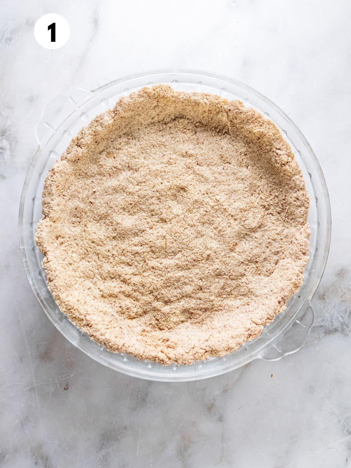 A pie crust on a pie plate.
