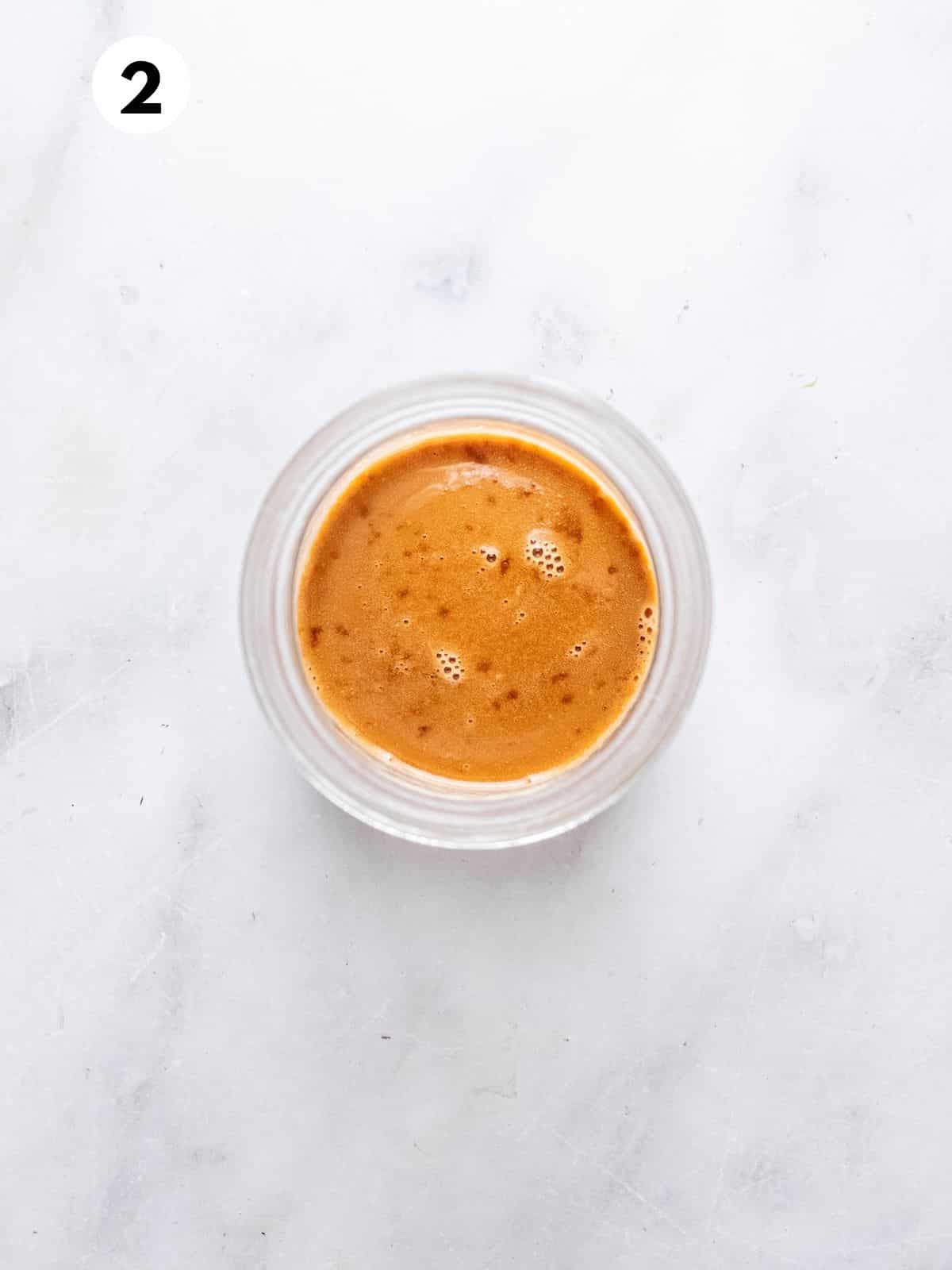 Caramel sauce in a small bowl.