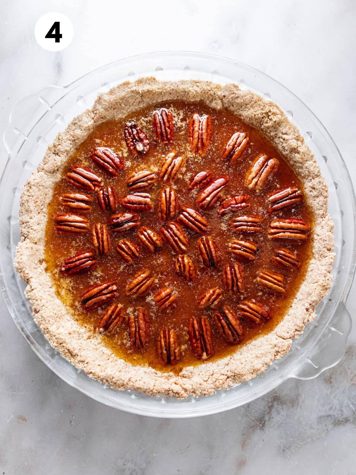 A prepared pecan pie ready to be baked.