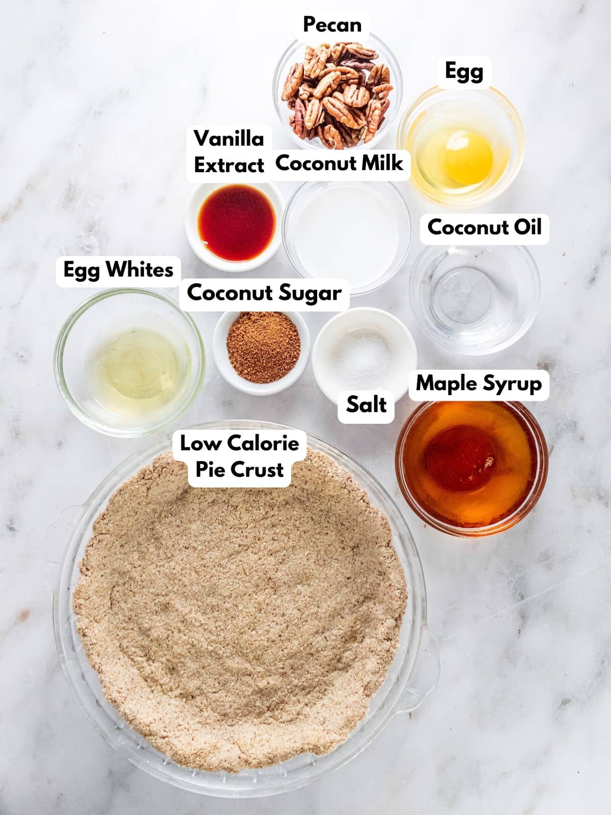 Ingredients for making a healthy pecan pie in bowls on a counter.