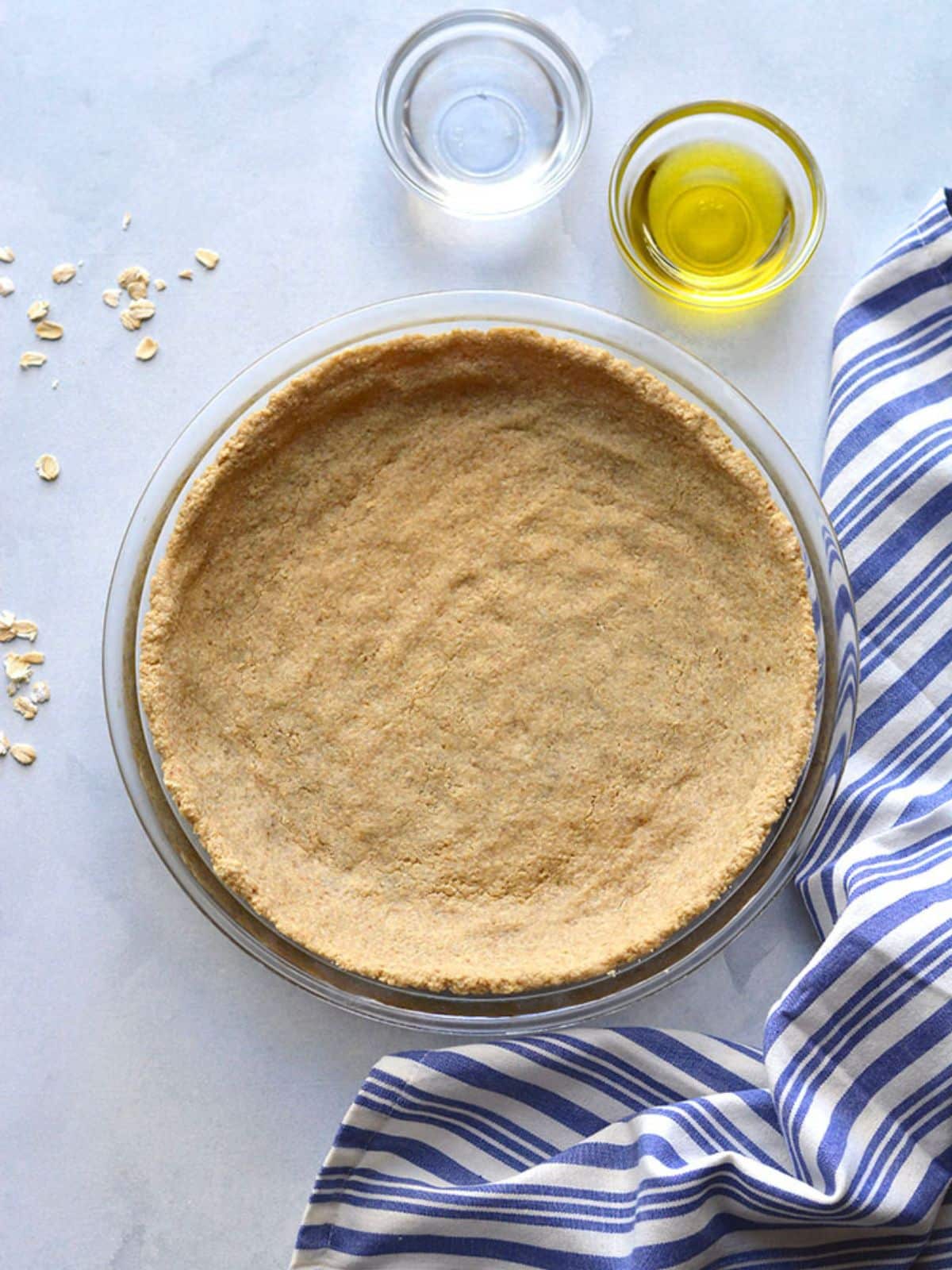 A healthy pie crust recipe baked and sitting on a counter.