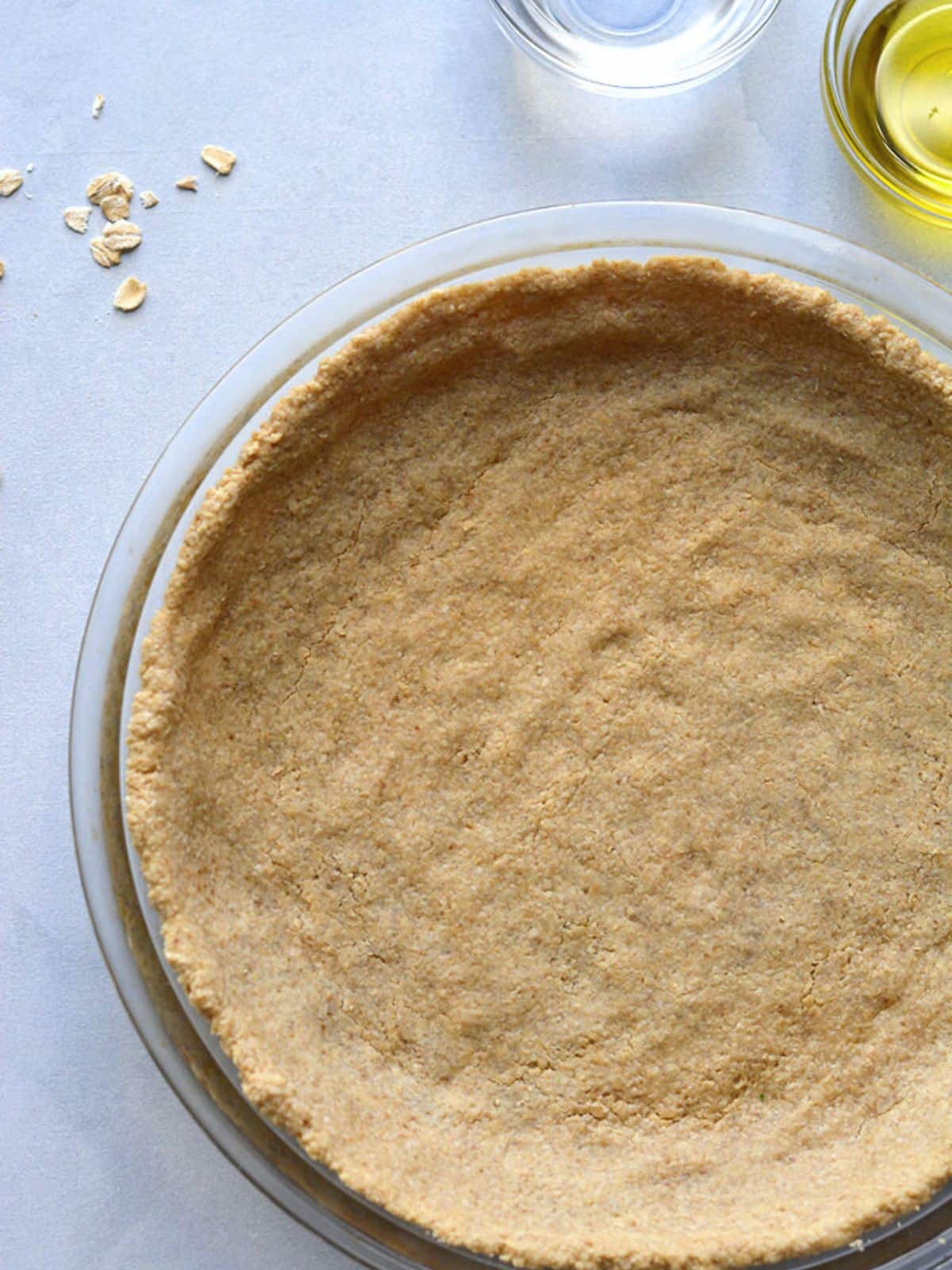 A healthy pie crust recipe baked and sitting on a counter.