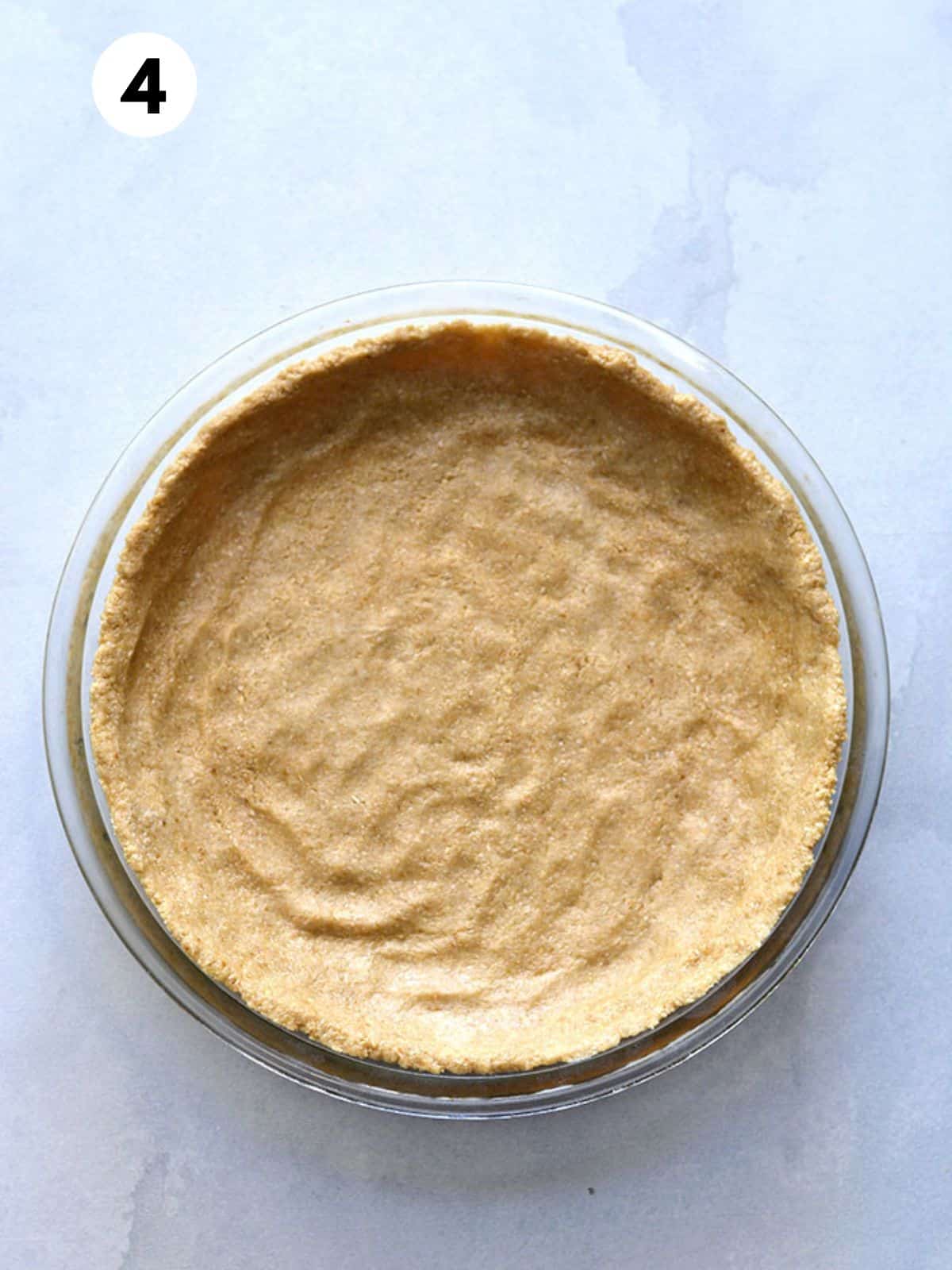 Pie crust dough pressed into a pie pan.