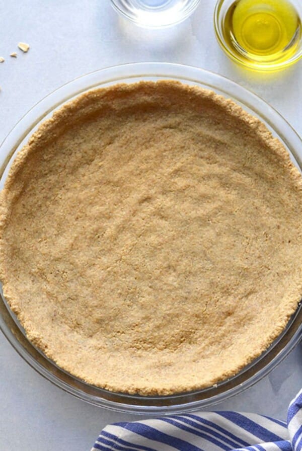 A healthy pie crust recipe baked and sitting on a counter.