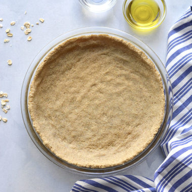 A Low Calorie Pie Crust that's made with just 3 healthy ingredients. An easy healthy pie crust that can be used for desserts, quiches and more. No rolling required! A healthy gluten free pie crust recipes that's lower in calories and vegan friendly. Low Calorie + Vegan + Gluten Free