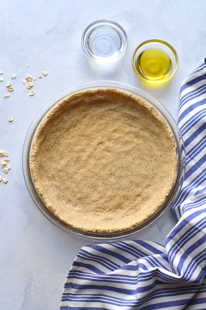 A Low Calorie Pie Crust that's made with just 3 healthy ingredients. An easy healthy pie crust that can be used for desserts, quiches and more. No rolling required! A healthy gluten free pie crust recipes that's lower in calories and vegan friendly. Low Calorie + Vegan + Gluten Free