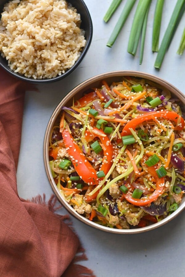 Healthy Egg Roll In A Bowl is an easy, gluten free and low calorie recipe that's made sugar free without a deep fried wrapper. A healthy weeknight dinner! Gluten Free + Low Calorie 