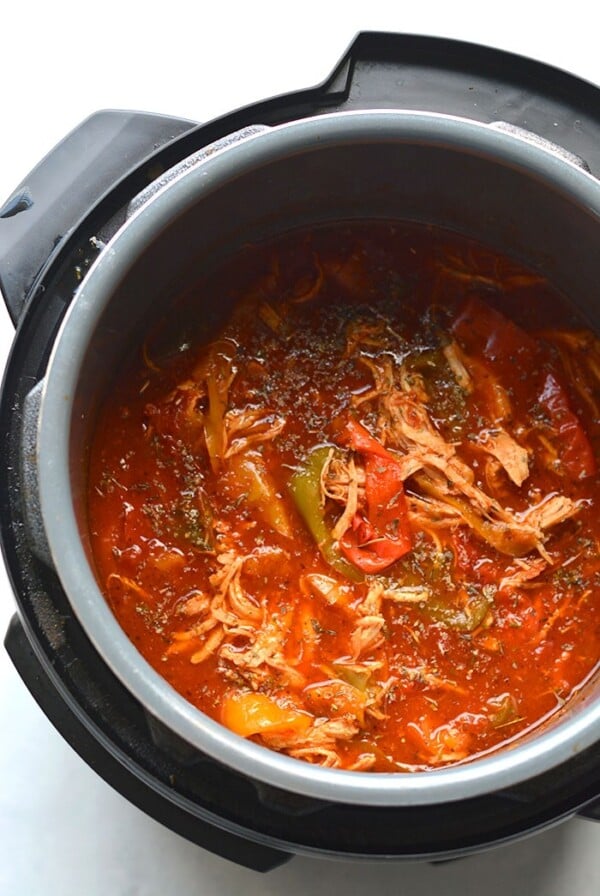 This Instant Pot Chicken and Peppers recipe is an easy 30-minute meal made with just 4 ingredients. Flavorful, low in calories and big on taste! Serve over rice, pasta, cauliflower rice or over a salad. A quick and versatile weeknight meal! Gluten Free + Low Calorie + Paleo