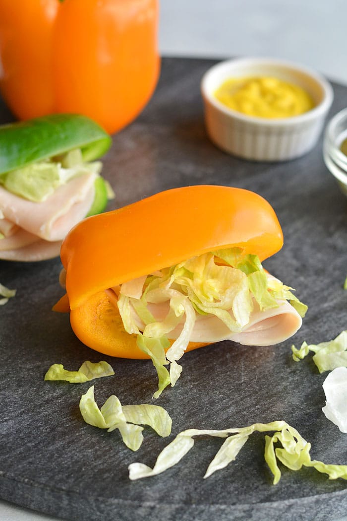 Low Carb Bell Pepper Sandwich! Swap the sandwich bread for sliced bell pepper. Add your toppings for an easy, low calorie lunch or snack. Low Carb + Gluten Free + Low Calorie + Paleo