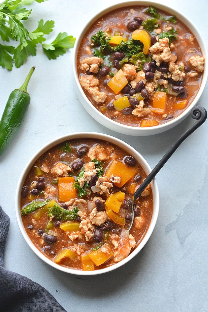 This hearty Turkey Kale Enchilada Soup is packed with flavor, nutrient rich foods and tons of flavor. A low calorie meal that comes together in 30 minutes! Gluten Free + Low Calorie