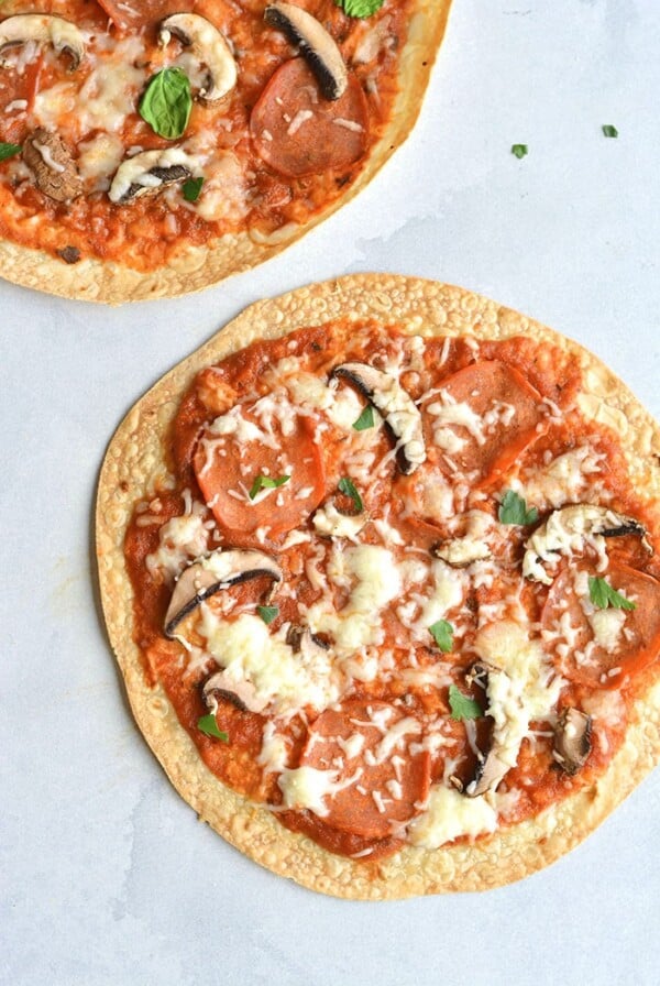Healthy Tortilla Pizza! This pizza is made gluten free on a brown rice tortilla. Customize the toppings with your favorite ingredients and enjoy this healthy meal or snack in less than 10 minutes. Gluten Free + Low Calorie