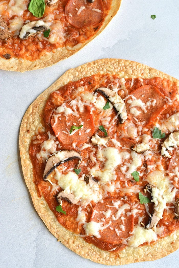 Healthy Tortilla Pizza! This pizza is made gluten free on a brown rice tortilla. Customize the toppings with your favorite ingredients and enjoy this healthy meal or snack in less than 10 minutes. Gluten Free + Low Calorie