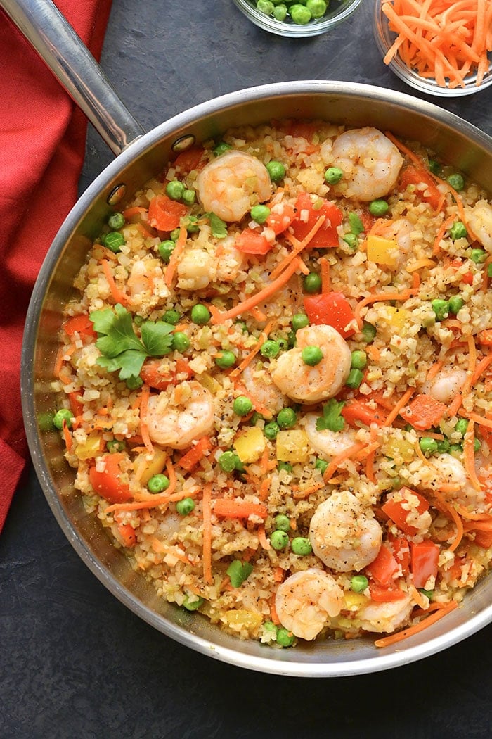 Healthy Shrimp Fried Rice is a veggie packed meal made low carb, low calorie and gluten free. A nutritious and filling meal that's family approved. Low Carb + Low Calorie + Gluten Free