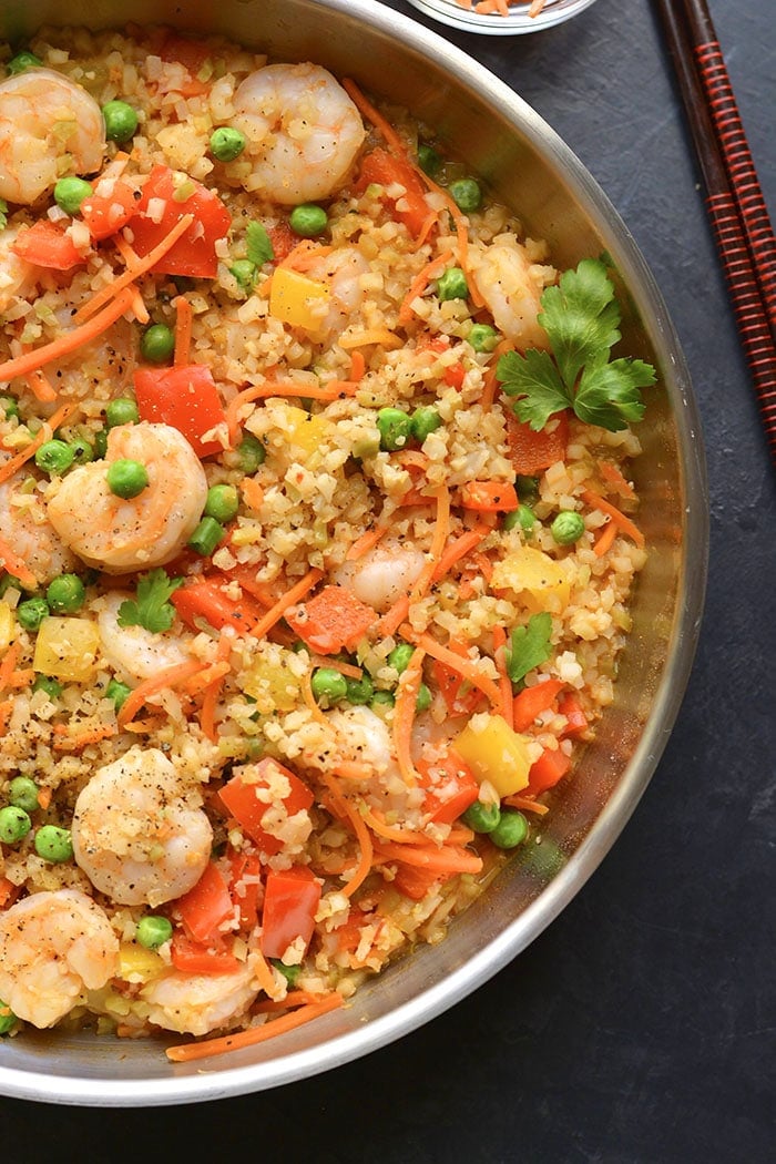 Healthy Shrimp Fried Rice is a veggie packed meal made low carb, low calorie and gluten free. A nutritious and filling meal that's family approved. Low Carb + Low Calorie + Gluten Free