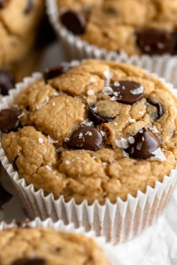 Low calorie healthy banana oat muffin on a platter with more.
