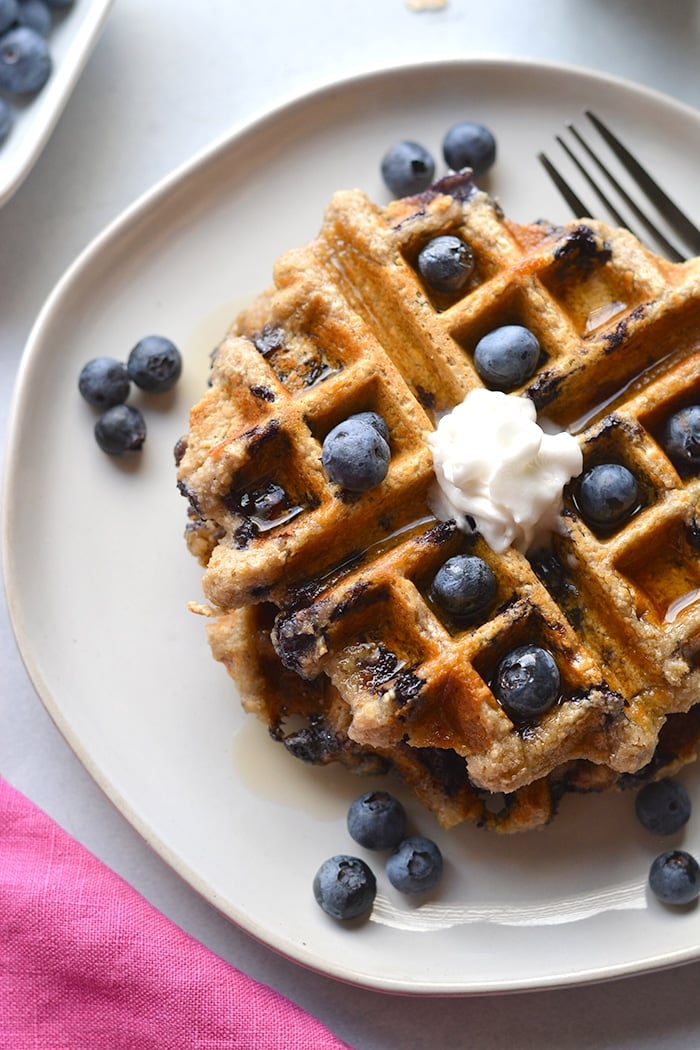 Healthy Blueberry Oat Waffles are low calorie made with gluten free oats and sugar free. Naturally gluten free and an easy meal prep healthy breakfast! Low Calorie + Gluten Free