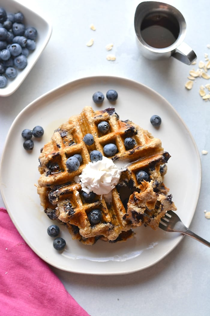 Healthy Blueberry Oat Waffles are low calorie made with gluten free oats and sugar free. Naturally gluten free and an easy meal prep healthy breakfast! Low Calorie + Gluten Free