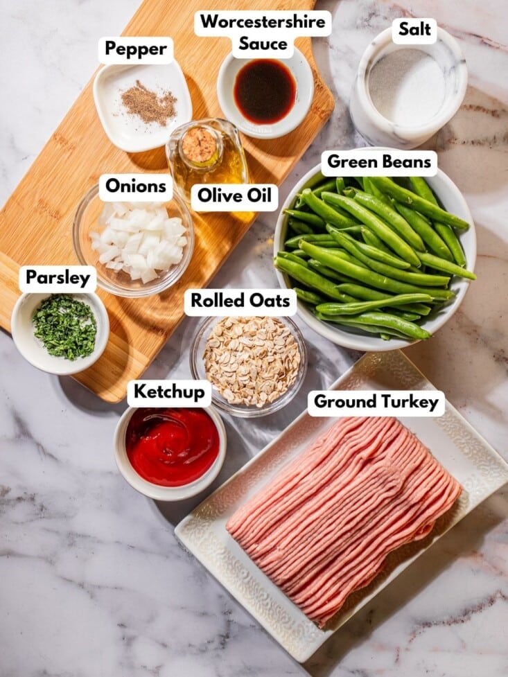 Ingredients to make this gluten free turkey meatloaf in bowls on a table.