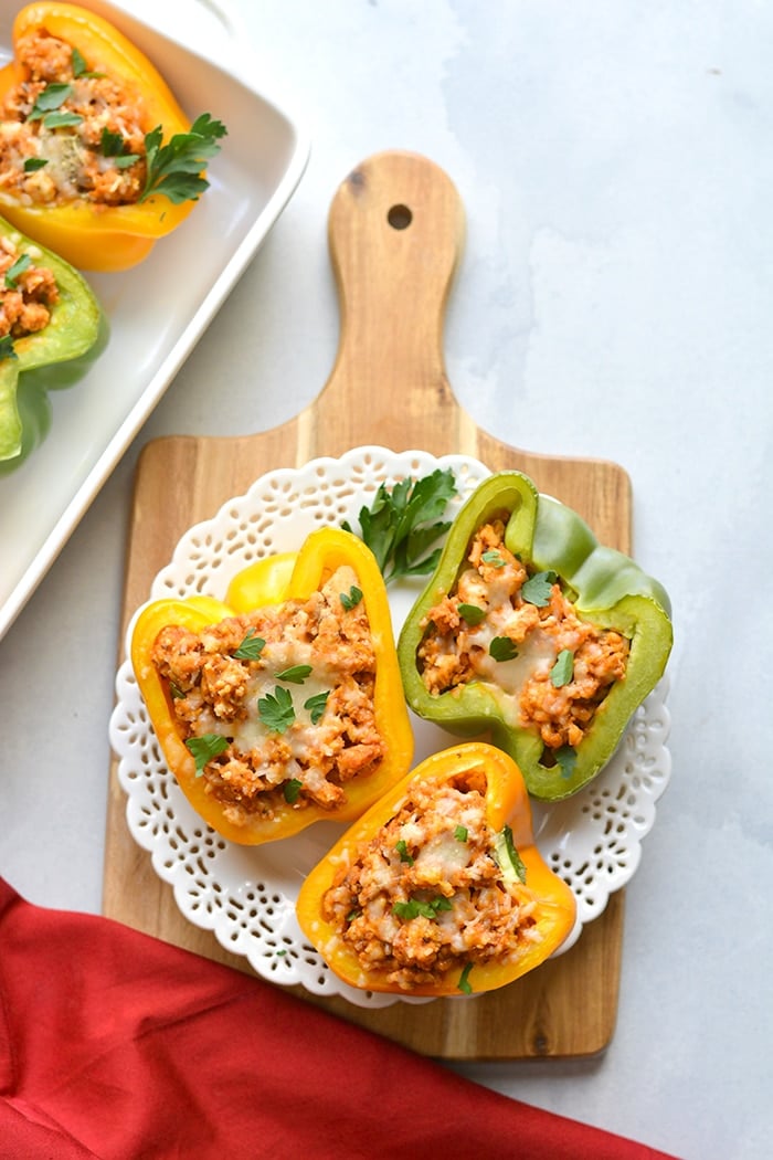 Italian Chicken Stuffed Peppers are a simple low calorie dinner to make! A delicious and hearty mixture of chicken, rice, pizza sauce and seasonings. These peppers are great for meal prep and reheat perfectly. Low Calorie + Gluten Free