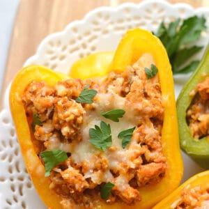 Italian Chicken Stuffed Peppers are a simple low calorie dinner to make! A delicious and hearty mixture of chicken, rice, pizza sauce and seasonings. These peppers are great for meal prep and reheat perfectly. Low Calorie + Gluten Free