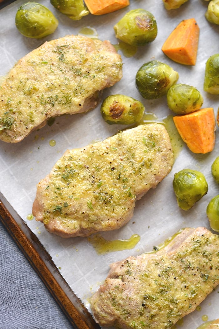 Healthy Ranch Pork Chops baked on a sheet pan with veggies for an easy, low calorie dinner packed with flavor! Easy to make and easy to cleanup too. Low Calorie + Gluten Free + Dairy Free + Paleo