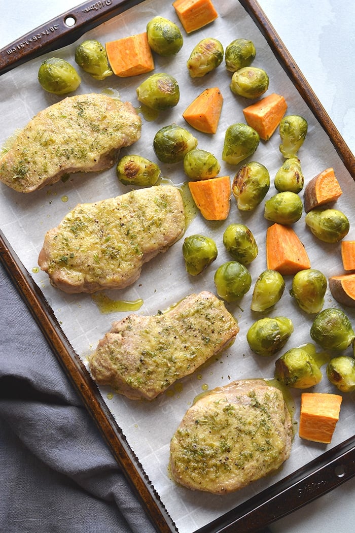 Healthy Ranch Pork Chops baked on a sheet pan with veggies for an easy, low calorie dinner packed with flavor! Easy to make and easy to cleanup too. Low Calorie + Gluten Free + Dairy Free + Paleo