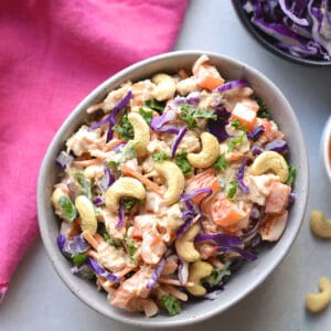 Healthy Cashew Chicken Salad made low calorie with Greek yogurt, bell peppers and cabbage. A healthy recipe that is mayo free and egg free. A great make ahead lunch to meal prep! Gluten Free + Low Calorie