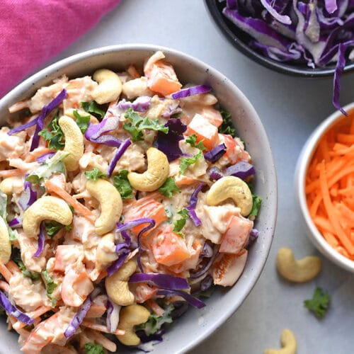 Healthy Cashew Chicken Salad made low calorie with Greek yogurt, bell peppers and cabbage. A healthy recipe that is mayo free and egg free. A great make ahead lunch to meal prep! Gluten Free + Low Calorie