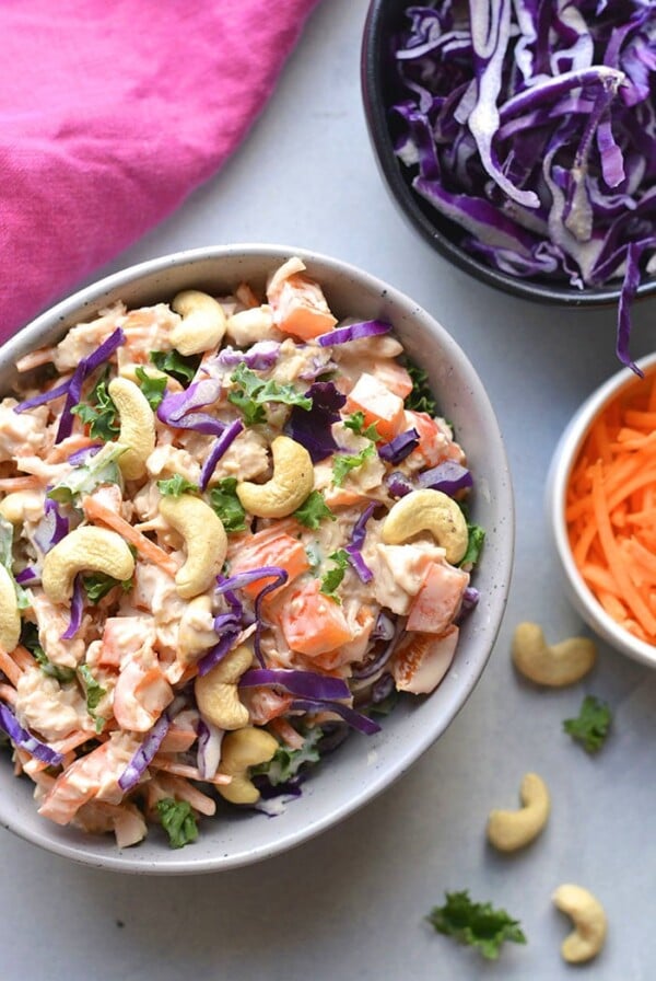 Healthy Cashew Chicken Salad made low calorie with Greek yogurt, bell peppers and cabbage. A healthy recipe that is mayo free and egg free. A great make ahead lunch to meal prep! Gluten Free + Low Calorie