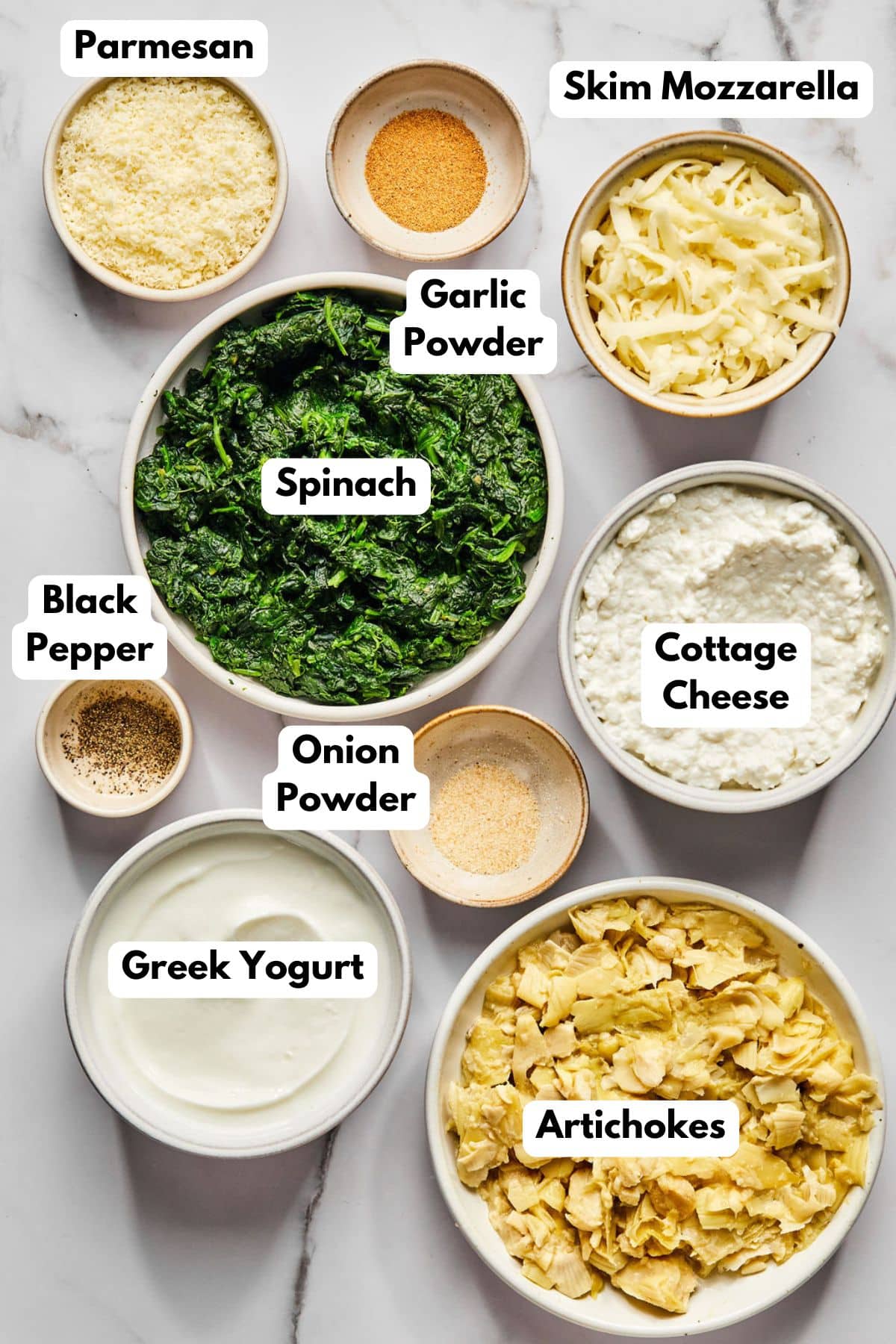 Ingredients to make protein spinach artichoke dip with text labels to identify each one.