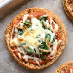 Low Calorie English Muffin Pizza is a healthy way to get your pizza fix! Top with your favorite toppings and enjoy healthy pizza in under 4 minutes. Low Calorie + Gluten Free