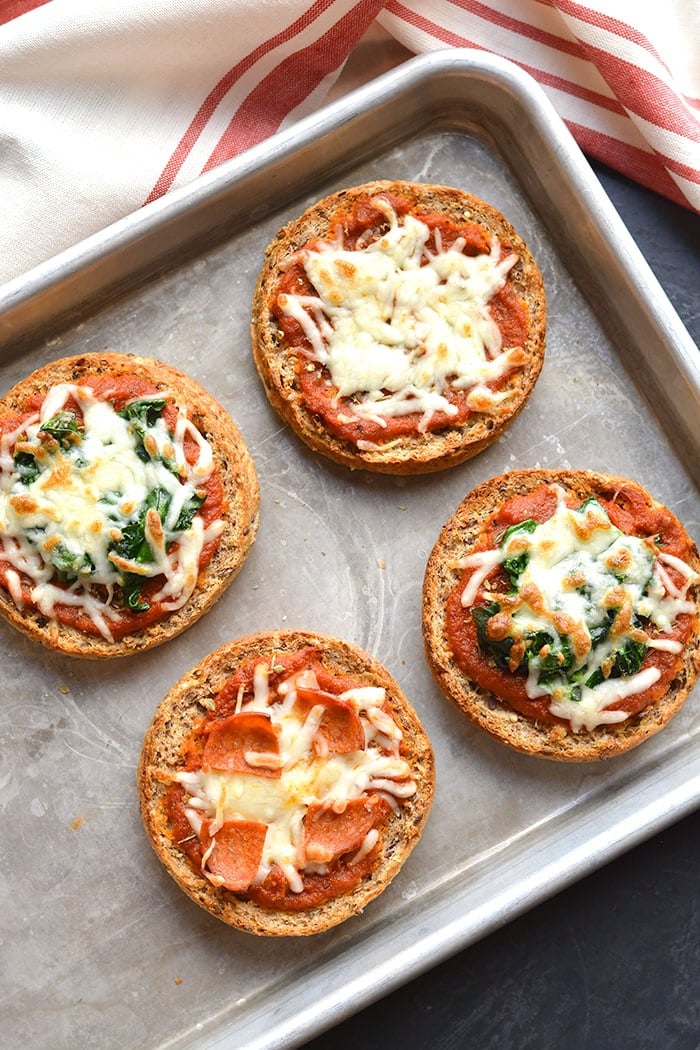 Low Calorie English Muffin Pizza is a healthy way to get your pizza fix! Top with your favorite toppings and enjoy healthy pizza in under 4 minutes. Low Calorie + Gluten Free