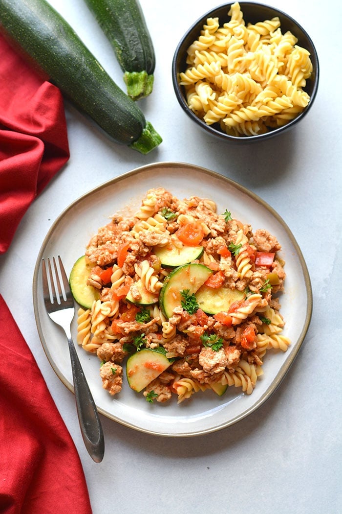 Healthy Taco Pasta is a low calorie dinner made with chickpea pasta, chicken, vegetables and salsa. High in protein and fiber, this family approved meal is healthy and easy to make! Gluten Free + Low Calorie