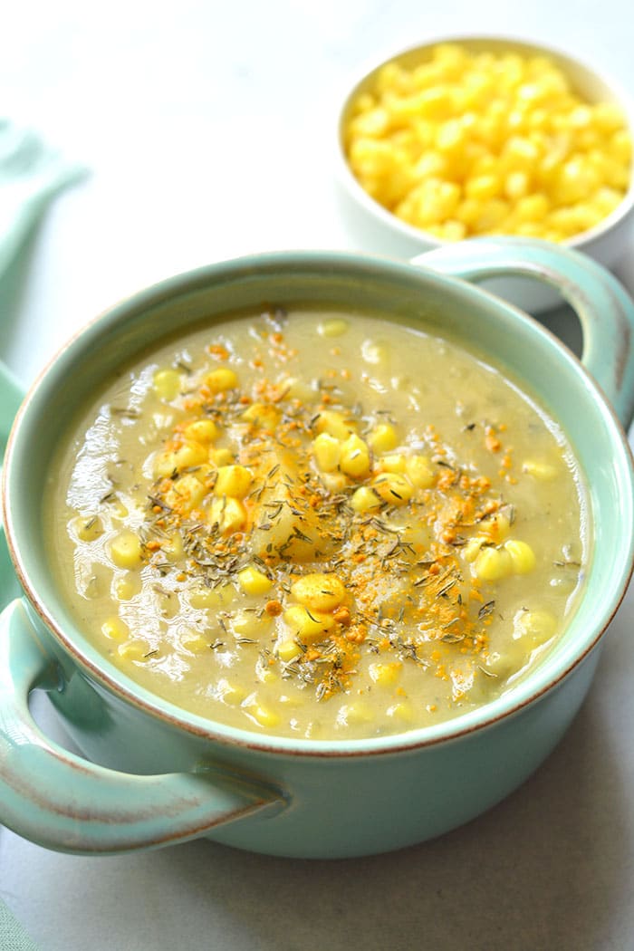 Healthy Corn Chowder made low calorie and creamy without cream using cauliflower to thicken it. A lightened up chowder that's dairy free, delicious and simple! Gluten Free + Vegan + Low Calorie