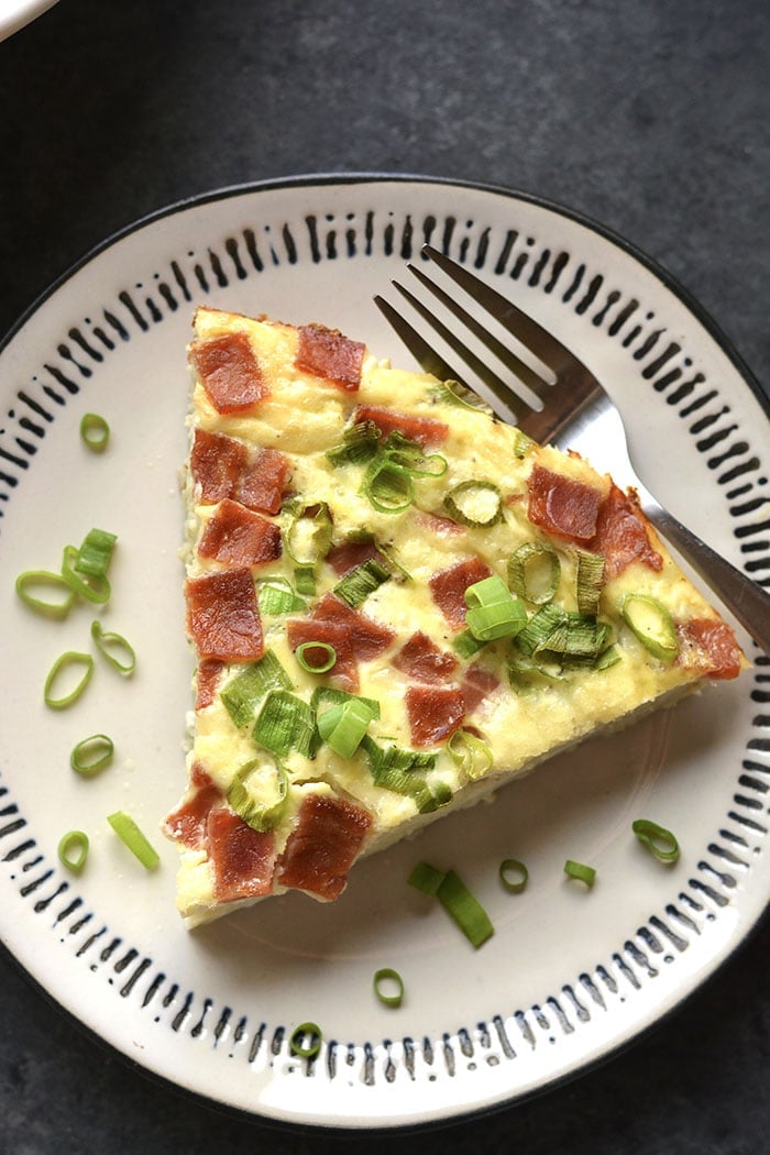 Healthy Quiche Lorraine is made crustless and replaces cauliflower the cream for a low calorie quiche Lorraine that's healthy and tasty! Gluten Free + Low Calorie + Paleo + Low Carb