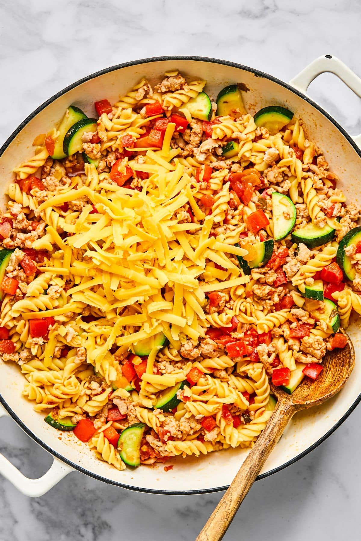 Cheese added to the skillet.