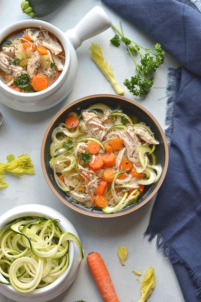 chicken soup with zucchini noodles in a bowl