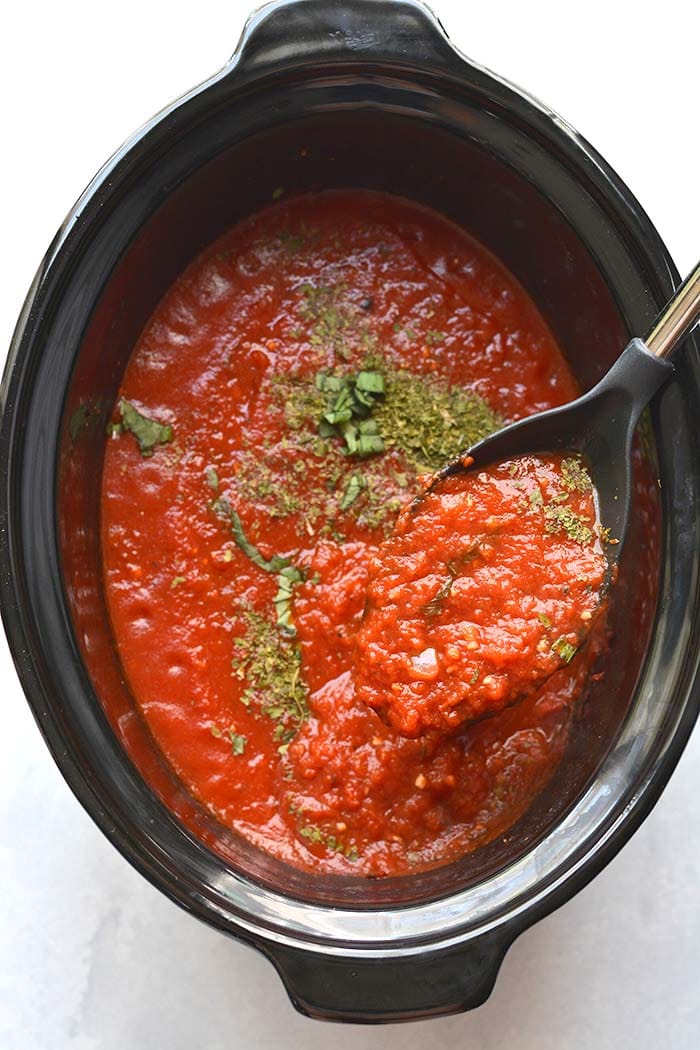 red pasta sauce in a ladle