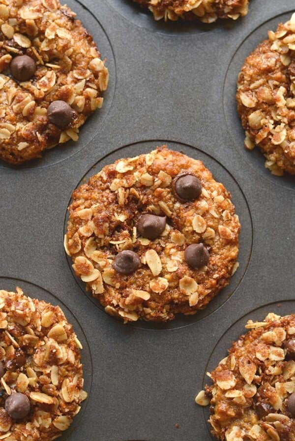 Healthy Greek Yogurt Muffins are low calorie chocolate chip muffins made with gluten free oats. Topped with a cinnamon streusel, they are a perfectly portioned snack! Gluten Free + Low Calorie
